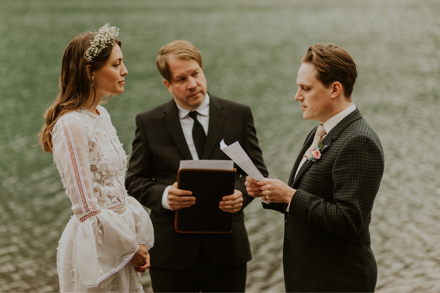 A Kananaskis Lake Elopement in the beautiful Canadian Rockies emotional photo of vows during ceremony