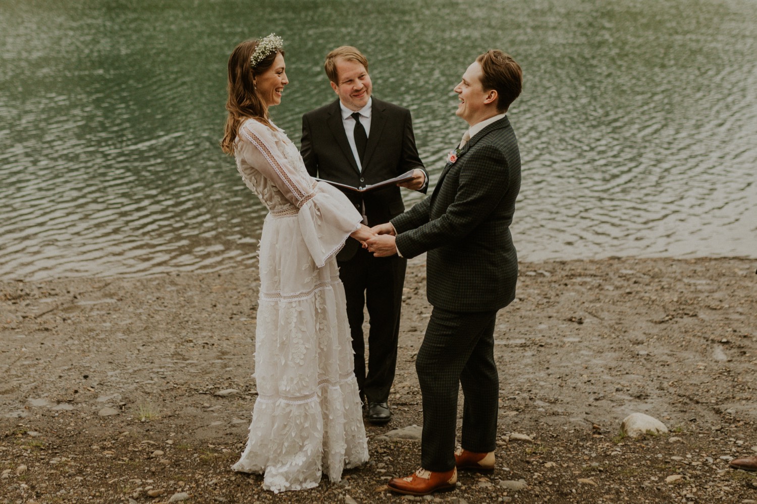 A Kananaskis Lake Elopement in the beautiful Canadian Rockies emotional photo of vows during ceremony