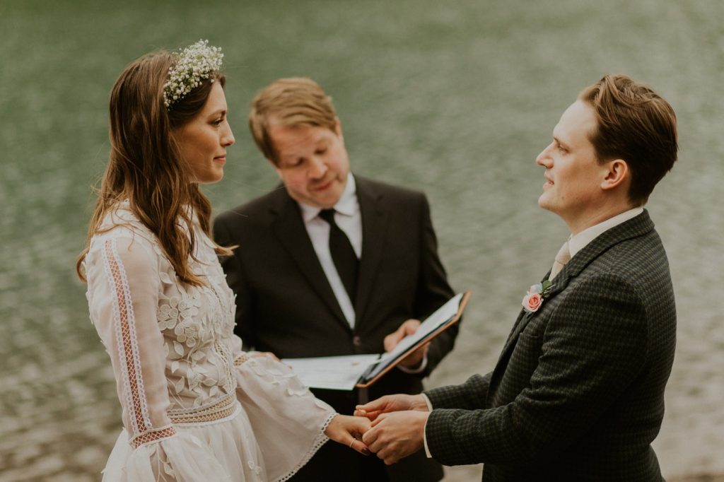 A Kananaskis Lake Elopement in the beautiful Canadian Rockies emotional photo of vows during ceremony