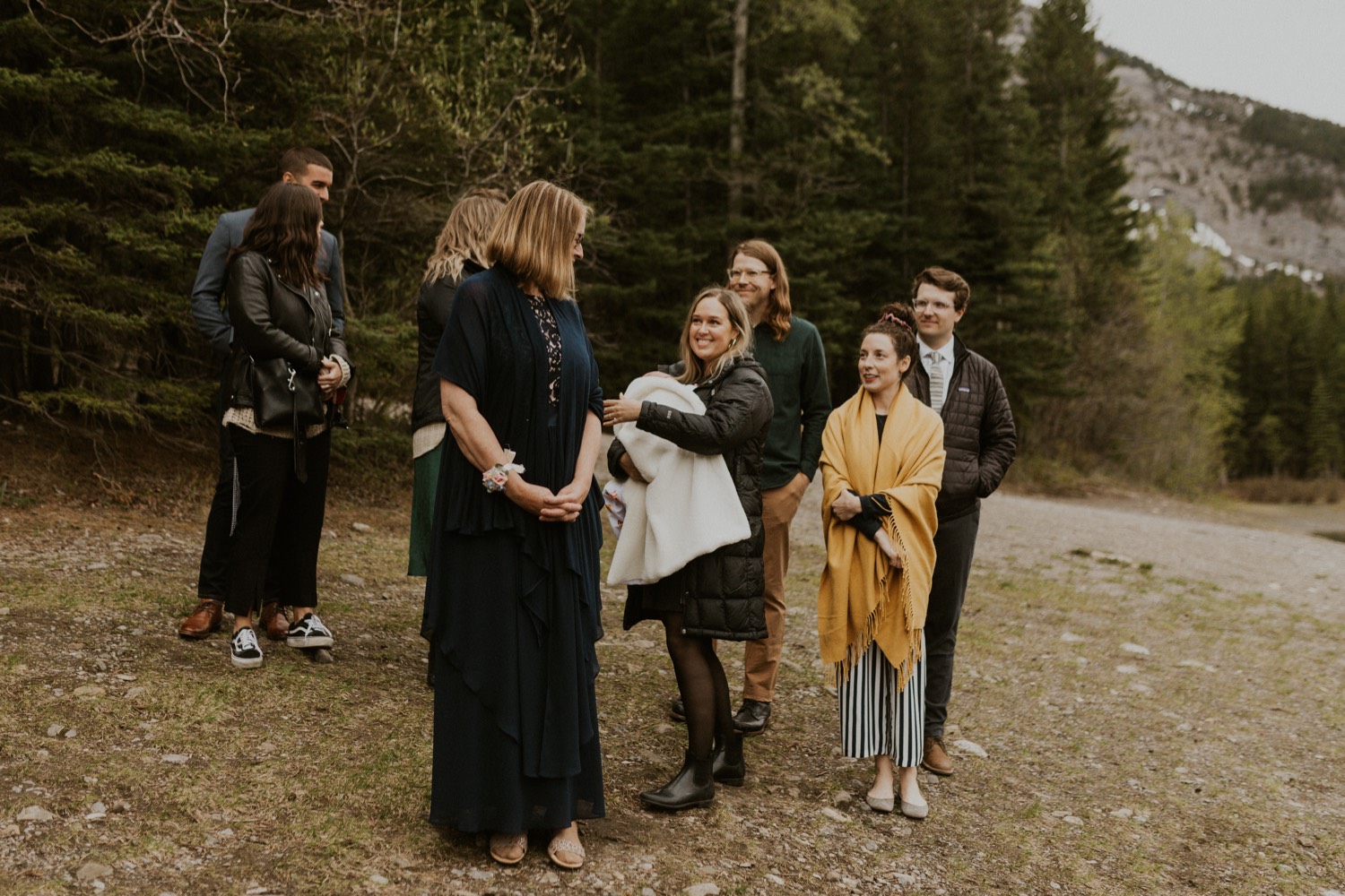 A Kananaskis Lake Elopement in the beautiful Canadian Rockies photo of family walking to ceremony spot