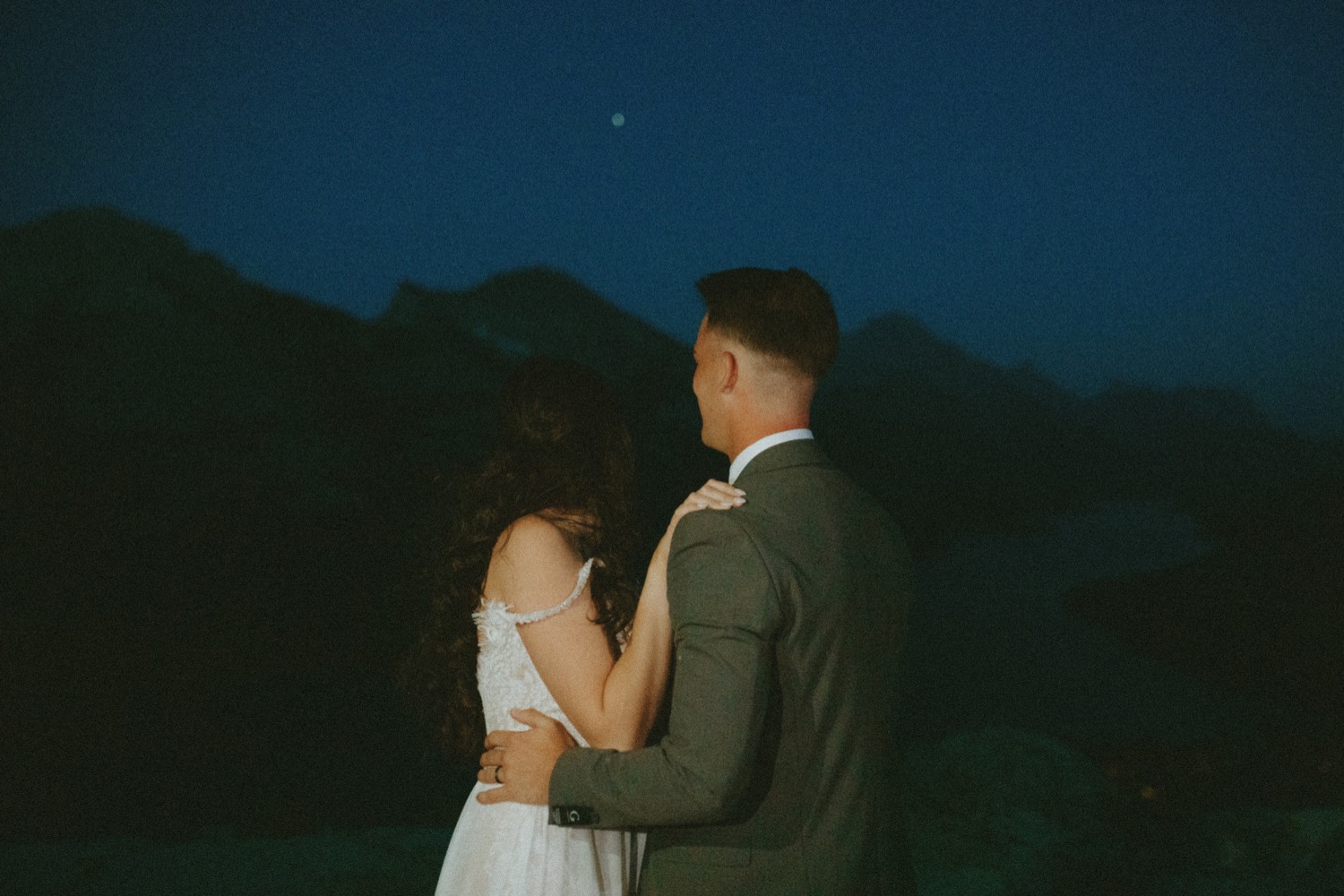 Waterton Wedding Adventurous Mountain Elopement style in the beautiful Canadian Rocky Mountains picture of couples first dance under the stars right after their elopement ceremony on a mountain top