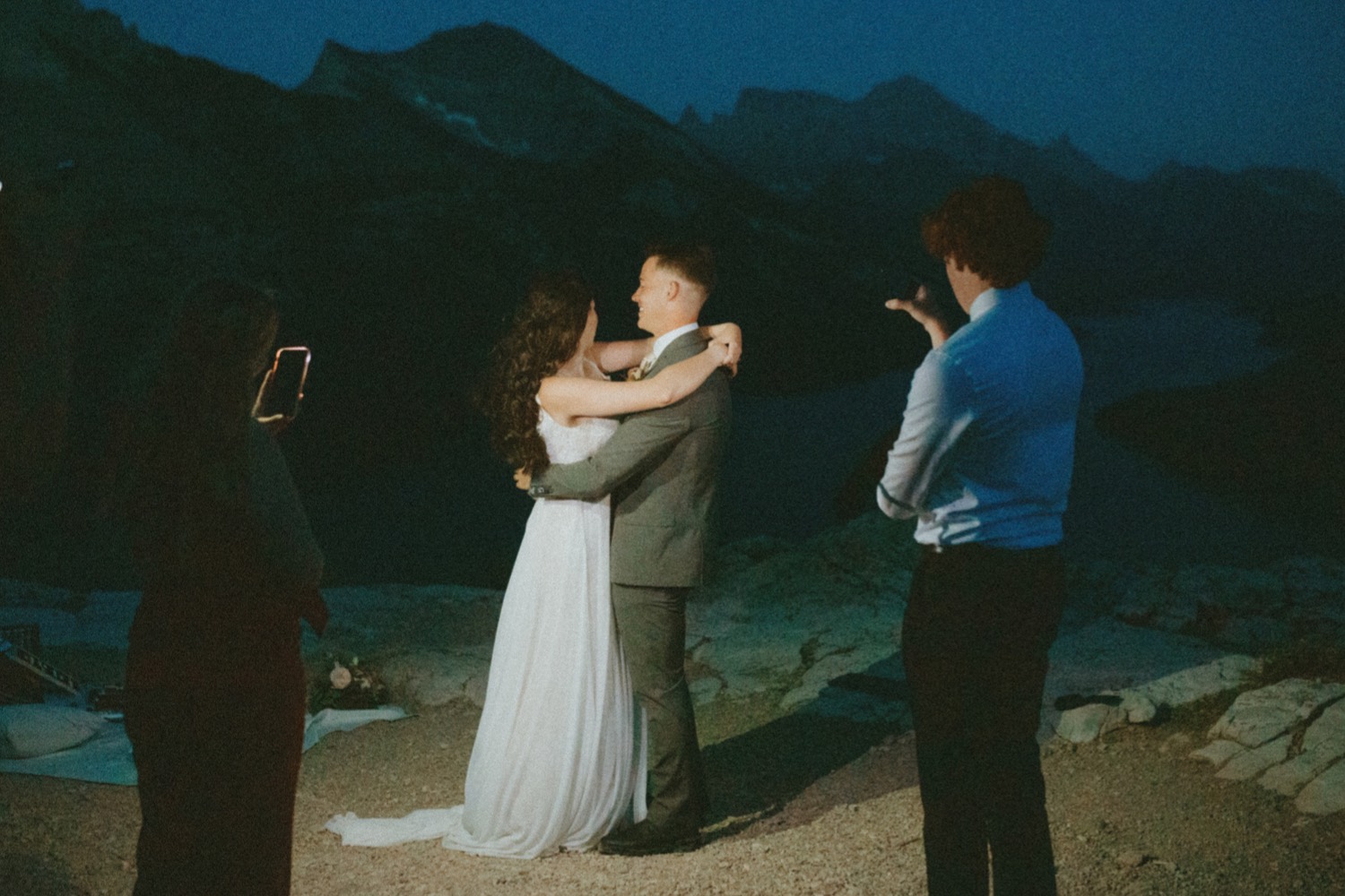 Waterton Wedding Adventurous Mountain Elopement style in the beautiful Canadian Rocky Mountains picture of couples first dance under the stars right after their elopement ceremony on a mountain top