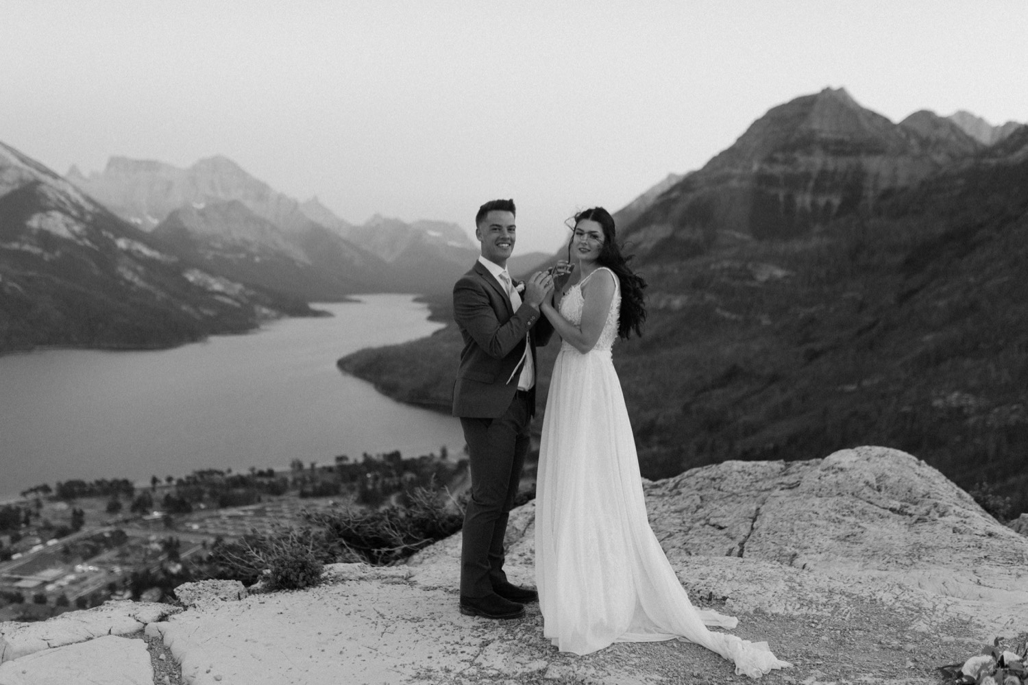 Waterton Wedding Adventurous Mountain Elopement style in the beautiful Canadian Rocky Mountains couple photos of couple on the mountain top right after their ceremony with close friends and officiant