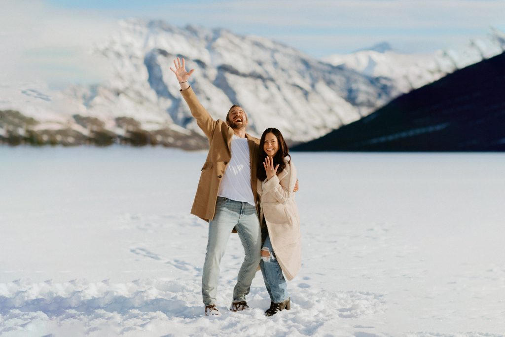 Banff Winter Engagement Photos in Banff National Park during sunrise golden hour after couples proposal shot by Havilah Heger Photography_99